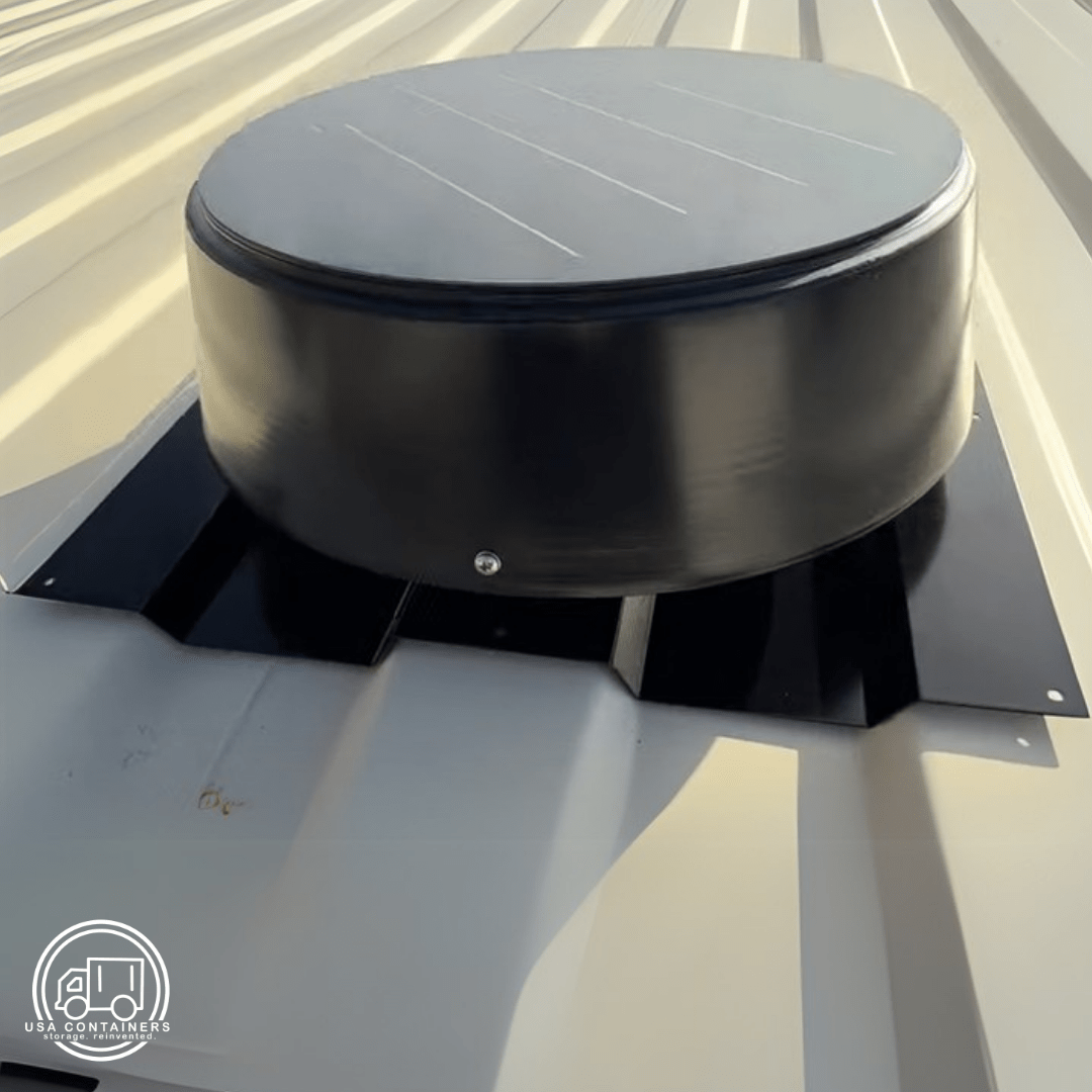 Black 10W solar-powered roof vent installed on corrugated metal shipping container roof panel.