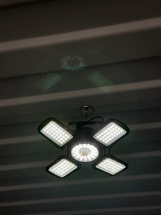 Bright solar shop light for lighting a shipping container interior, detail view
