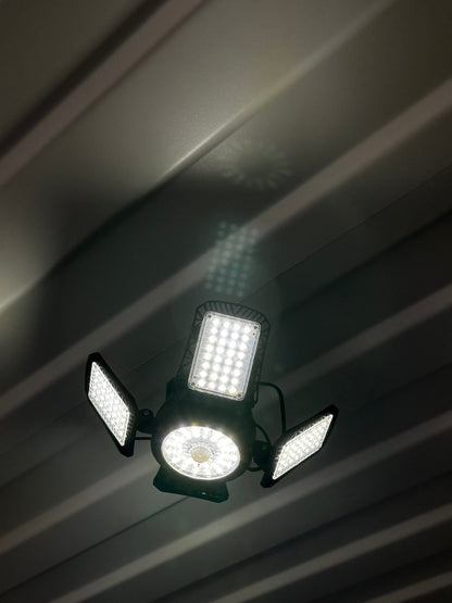 Bright solar shop light for lighting a shipping container interior, angle view