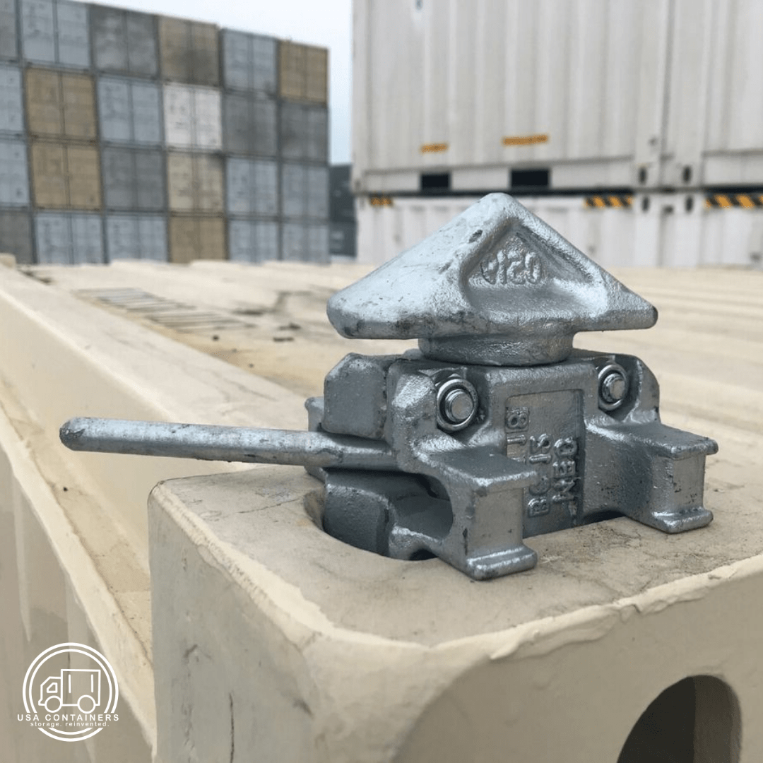 Manual twist lock securing shipping containers for safe stacking and stabilization without tools or levers needed.