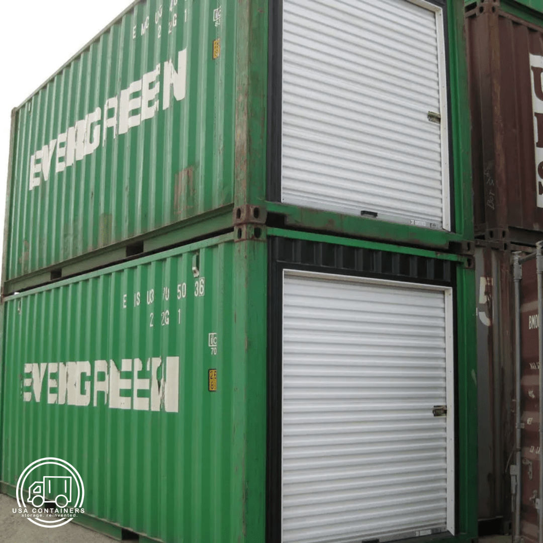 Green shipping containers with white roll up doors installed on the side for easy access and durability.