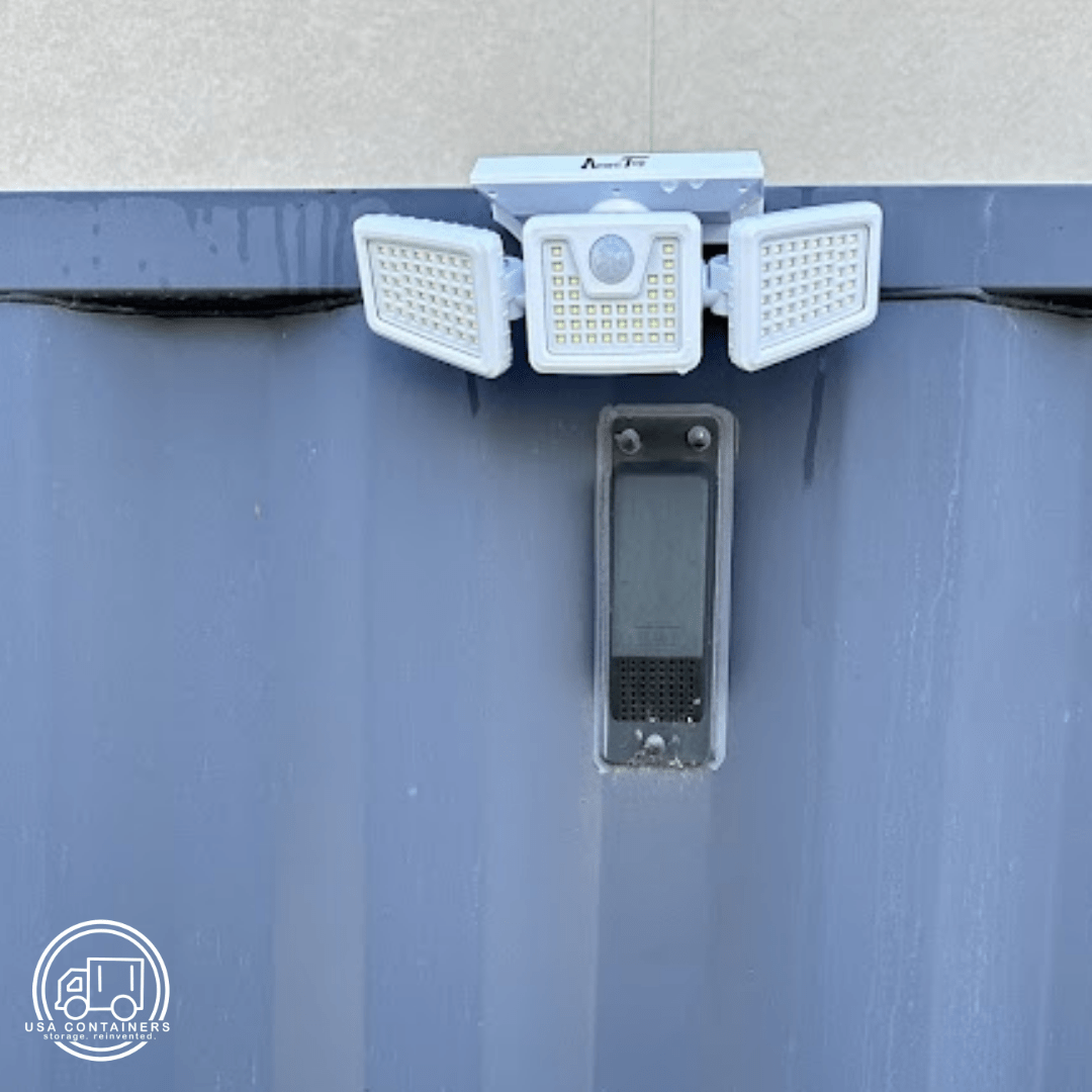 Ultra-wide adjustable solar powered light with 188 LEDs mounted on a shipping container exterior wall.