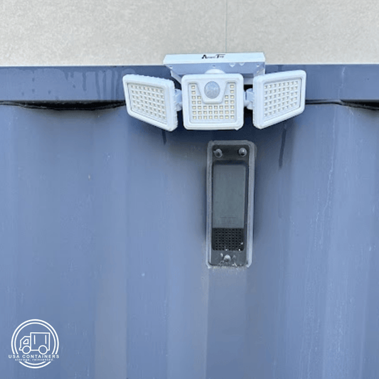 Ultra-wide adjustable solar powered light with 188 LEDs mounted on a shipping container exterior wall.