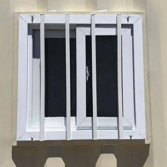 Secured shipping container windows with steel security bars installed in a container wall